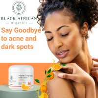 Model applying Vitamin C Brightening Face Cream on her skin with a jar of the product nearby.